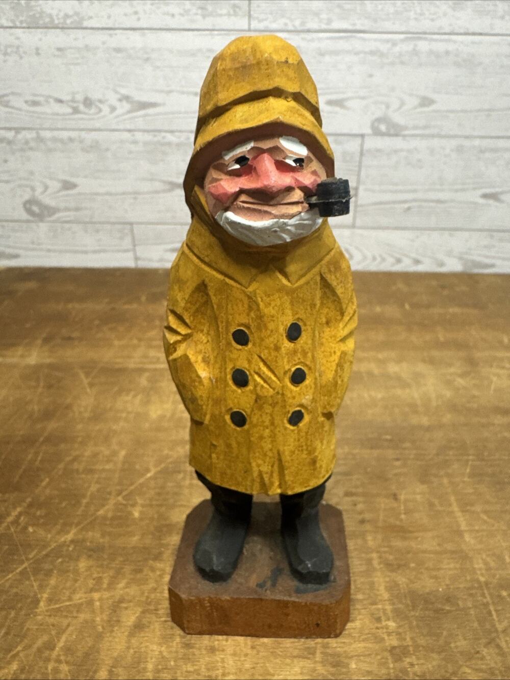 Hand Carved Wood Old Man in Orange Rain Jacket Smoking Pipe Sailor